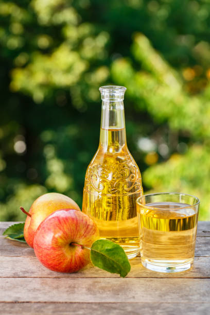 istock apple cider or juice in decanter 697881338