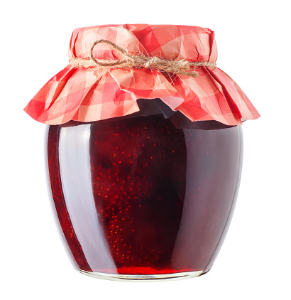 strawberry jam isolated on white background. Preserved fruits. Homemade strawberry jam in glass jar covered with paper