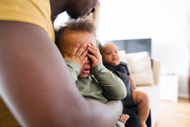 istock Unrecognizable afro-american father holding his little daughter 697884410