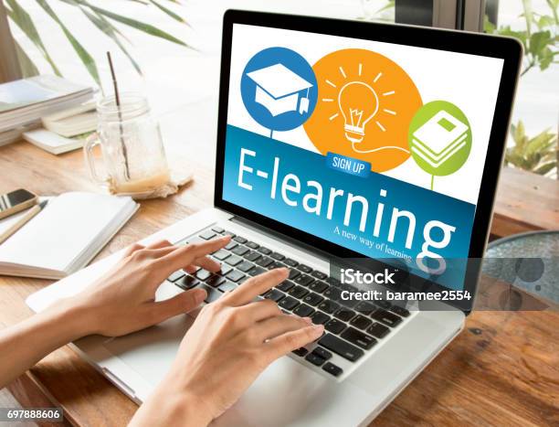 Hand Typing On Computer Keyboard With Elearning Education On Screen Internet Online Study Concept Stock Photo - Download Image Now