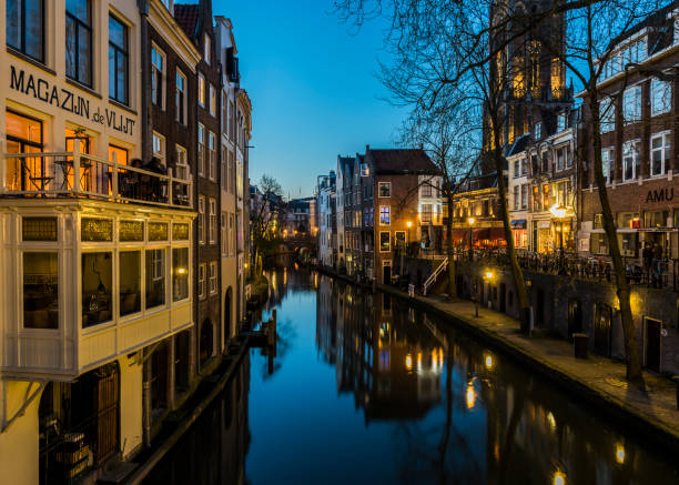 Utrecht: Oude Gracht at night with the Dom (church) and canal, restaurants and monumental houses.