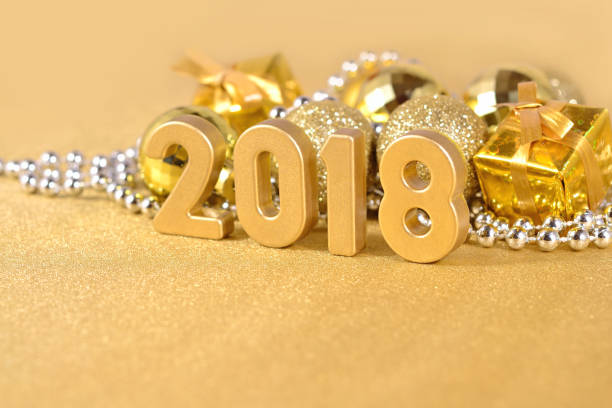 istock 2018 year golden figures and Christmas decorations 697896016