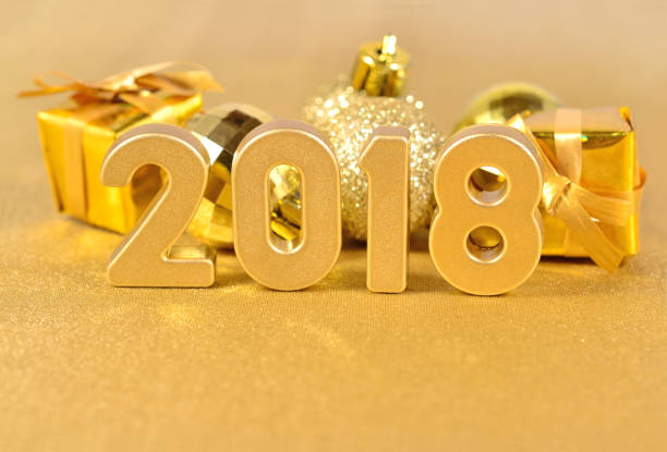 istock 2018 year golden figures and Christmas decorations 697896124