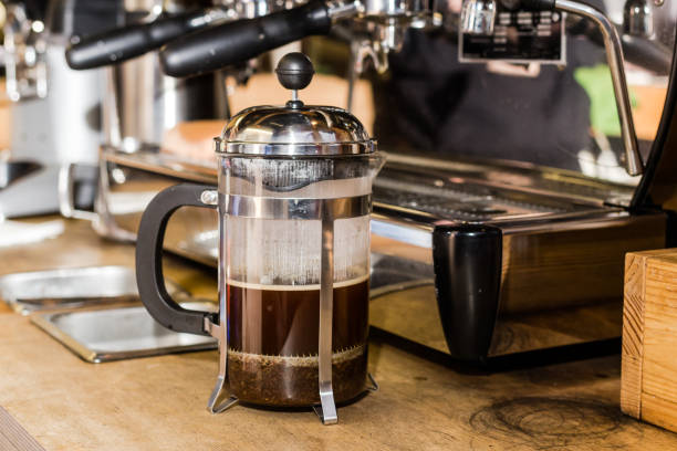 istock Barista making non traditional coffee in french press 697900544