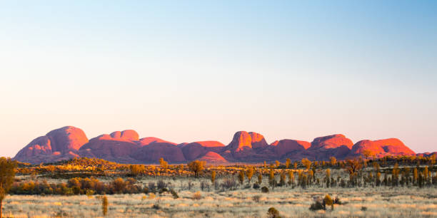 The Olgas, Australia- February 6, 2010: The road that brings to the rock formation known as &amp;amp;quot;the olgas&amp;amp;quot; or &amp;amp;quot;the heads&amp;amp;quot; in the Northern Territory