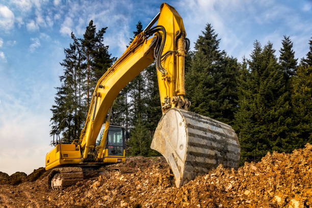 istock Yellow excavator on highway construction S7, Naprawa, Poland 697902728