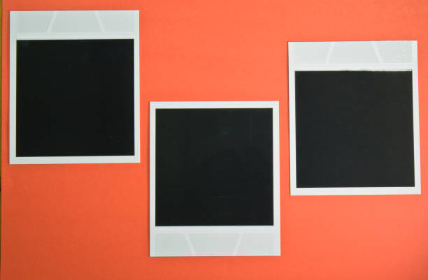 istock three blank instant photo frames on red background with copy space top view 697906040