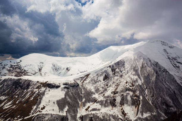 istock Mountains in snow against blue sky. Georgia. 697912818