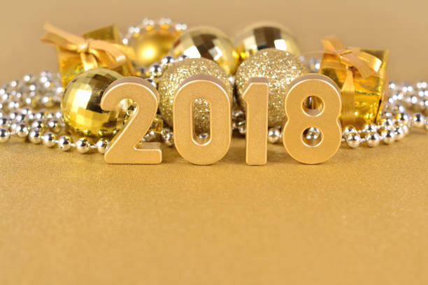 istock 2018 year golden figures and Christmas decorations 697920492