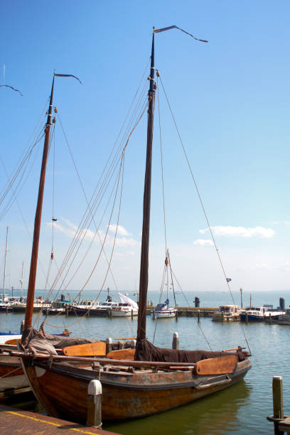 Moody shots of boats tied alongside the moorings at Volendam, Holland stock photo