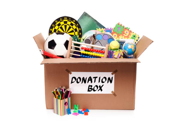 istock Donation box with toys and school supplies 697920892