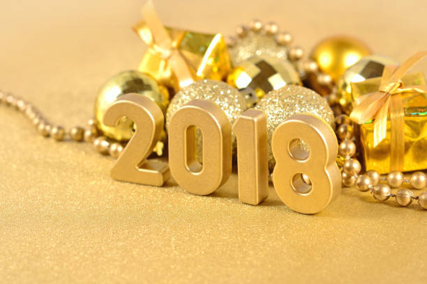 istock 2018 year golden figures and Christmas decorations 697921052