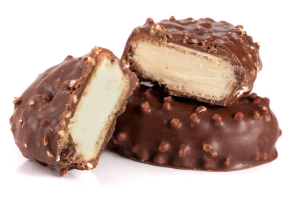 istock chocolate candy with white cream filling isolated on white background 697921272
