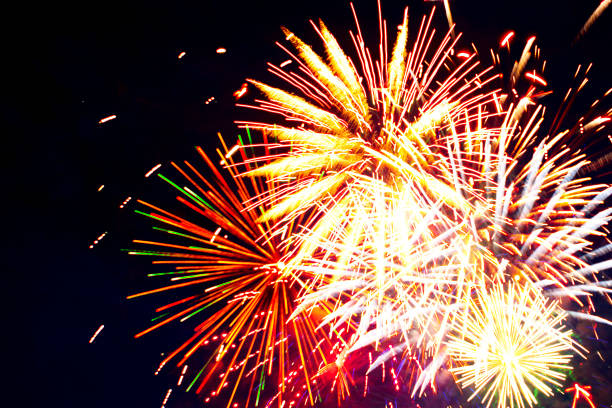 istock Fireworks in the evening sky with majestic clouds, long exposure 697927442