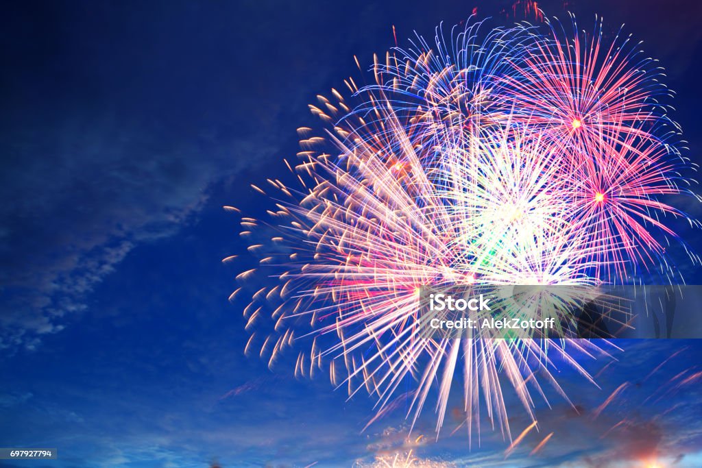 Fireworks display on 4th of July Fireworks display on 4th of July. Fireworks display on dark sky background. Independence Day, 4th of July, Fourth of July or New Year. Firework - Explosive Material Stock Photo