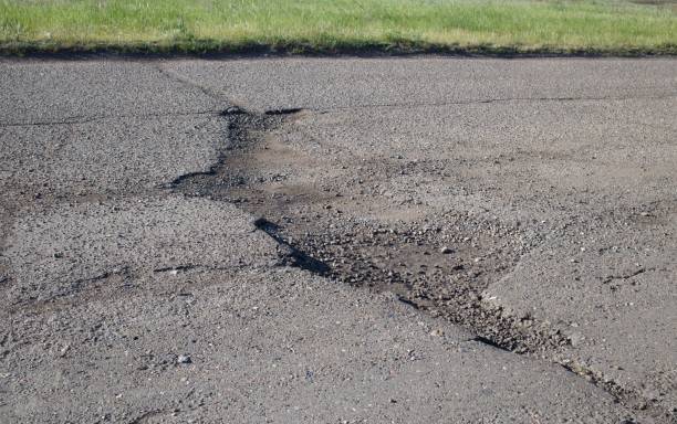 istock The hole in asphalt road 697928592