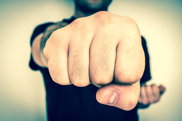 istock Young boxer showing punch a fist 697931672