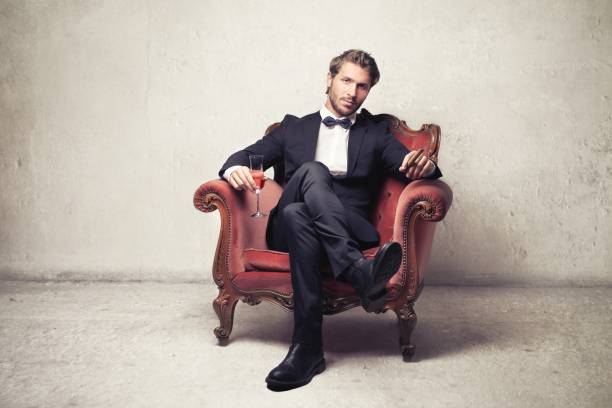 Sir Gentleman in suit is sitting in an armchair man cigar stock pictures, royalty-free photos & images