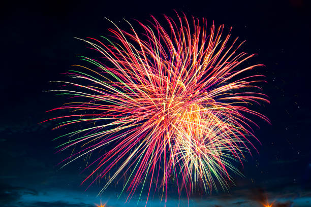 istock Brightly colorful fireworks and salute in the night 697932516