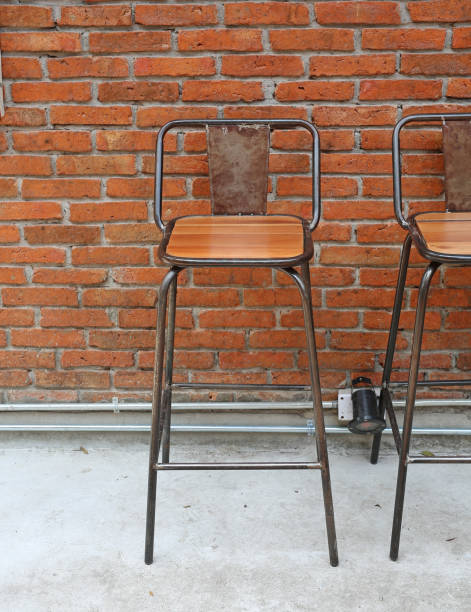 istock Vintage chair against brick wall background. 697932992