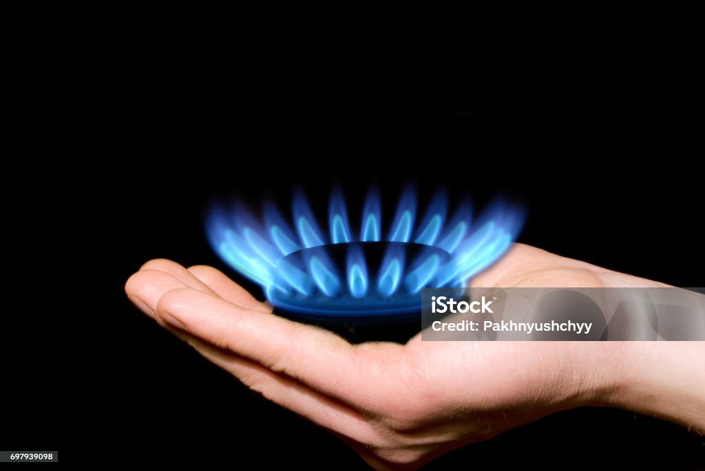 gas Hands holding a flame gas Blue Stock Photo