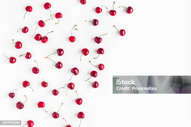 Cherry Pattern On White Background Flat Lay Top View Stock Photo - Download Image Now