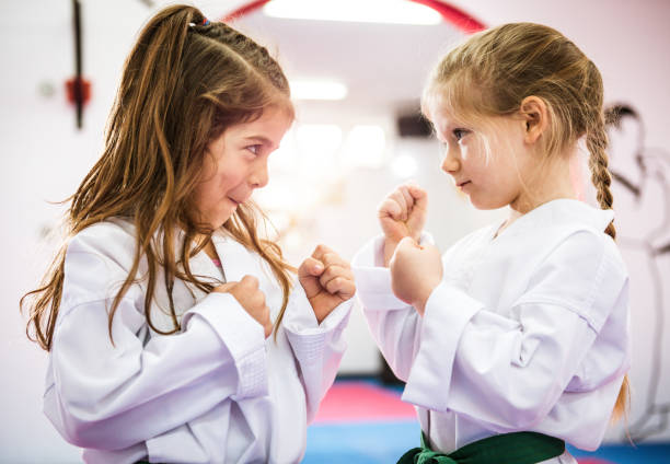 istock Two cutest opponents in taekwondo 697945766