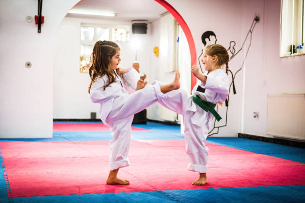 istock Cute girls on Taekwondo training 697946008