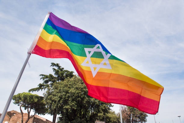 istock Rainbow peace flag and jewish star of david 697953682