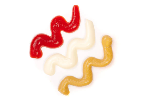 istock Ketchup mayonnaise and mustard isolated on white background. Top view 697954470