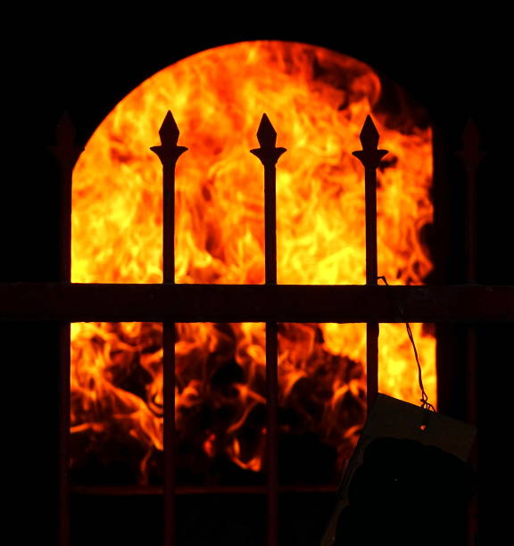 fire through the grate of an old fireplace