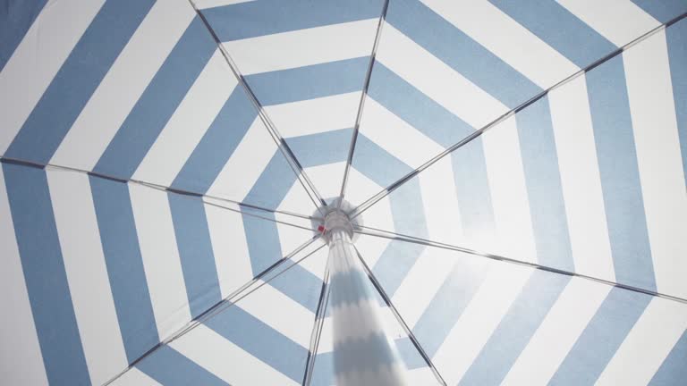 Symbols of summer: spinning beach umbrella