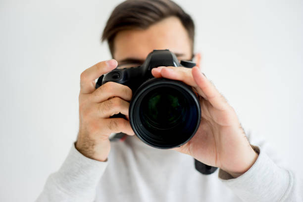 istock Male photographer with camera 697959412
