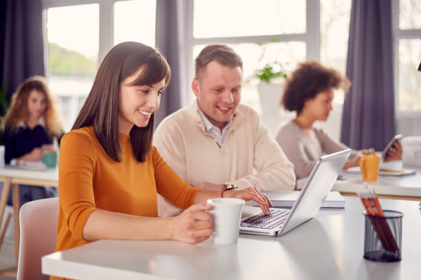 istock Young happy people discussing business issues 697959938
