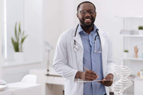 istock Handsome professional doctor looking at you 697960658