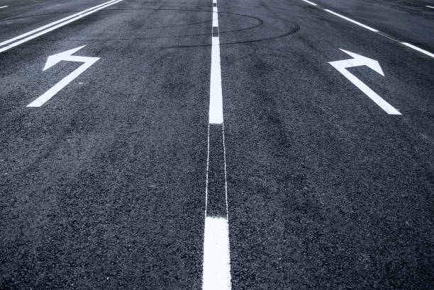 istock Road arrow sign left right turn 697967258