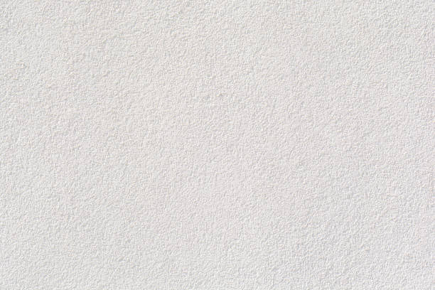 istock white cement wall, texture stone concrete, rock plastered stucco wall painted flat fade pastel background white grey solid floor grain. 697974850
