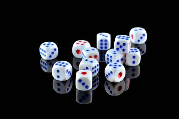 Group of White dice over black background