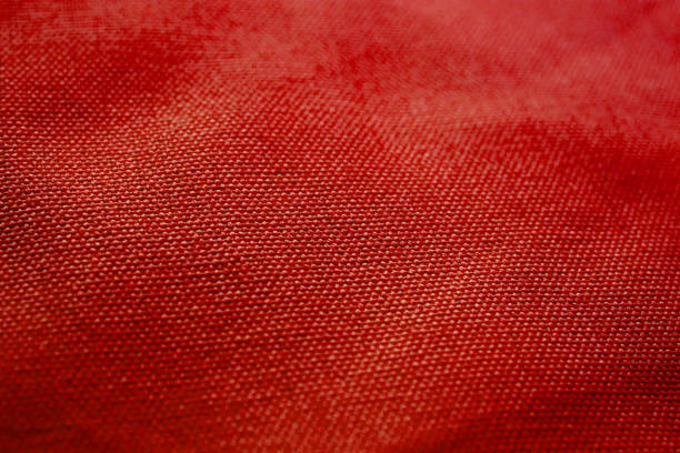 istock Red fabric texture. Red cloth background. Close up view of red fabric texture and background. Abstract background and texture for designers. 697975552