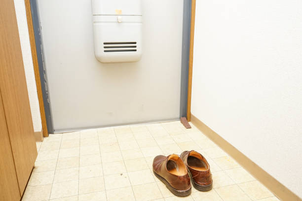 istock Leather shoes at the door 697979038