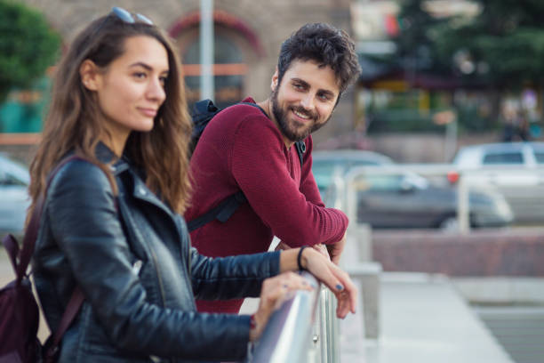 istock Boy smiling to a girl and flirting 697982930