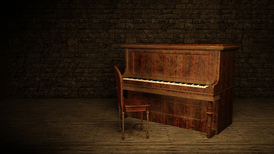 An old piano sits in a darkened room