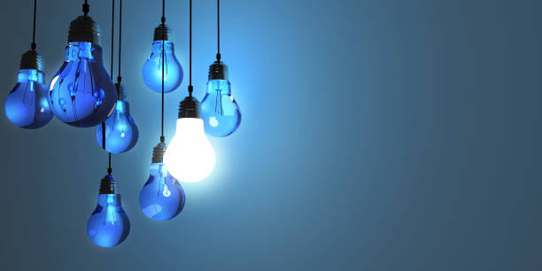 istock Idea concept, Hanging light bulbs with glowing one isolated on dark blue background.3d rendering 697998562