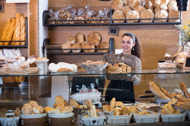 istock young woman at bakery display 697998686