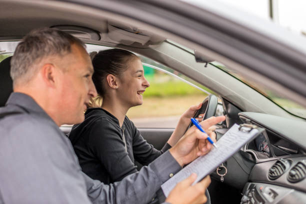 istock Driving Test, Focused on the road ahead of her 698001026