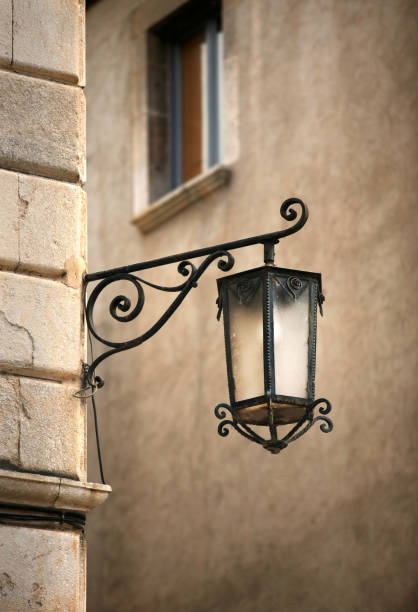 istock Street lantern on a background of a wall 698005114