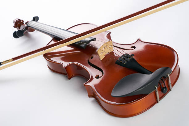 istock Violin with bow isolated on white background. 698009960