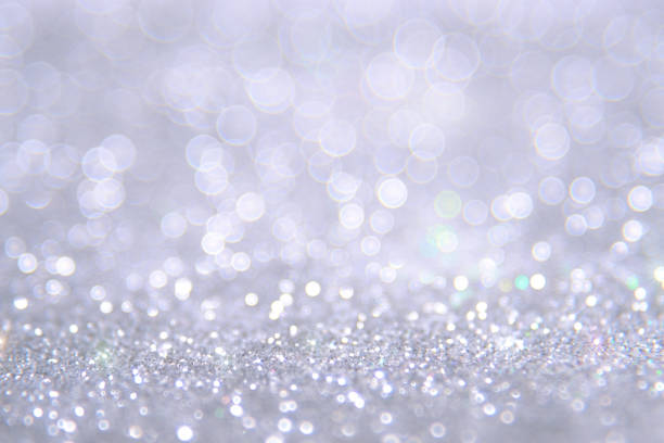 istock Silver and white bokeh lights defocused. abstract background 698012610
