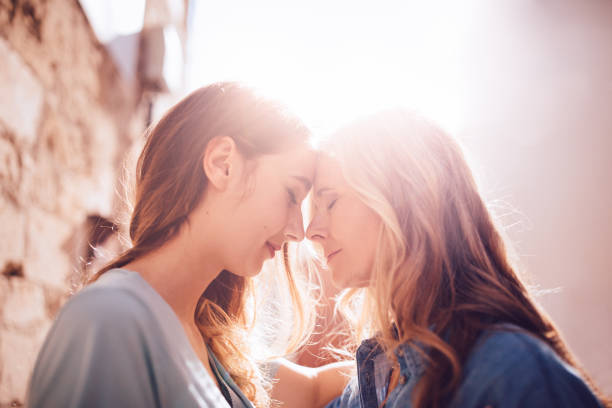 istock Affectionate senior mother and daughter hugging in the sun 698012734