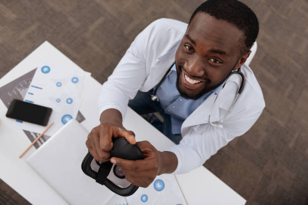istock Cheerful delighted scientist looking at you 698016906